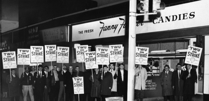 TWU members with strike signs in front of Fanny Farmer store